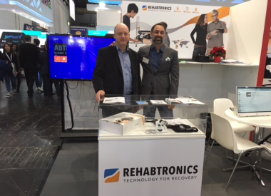 team members in trade show booth Rehabtronics