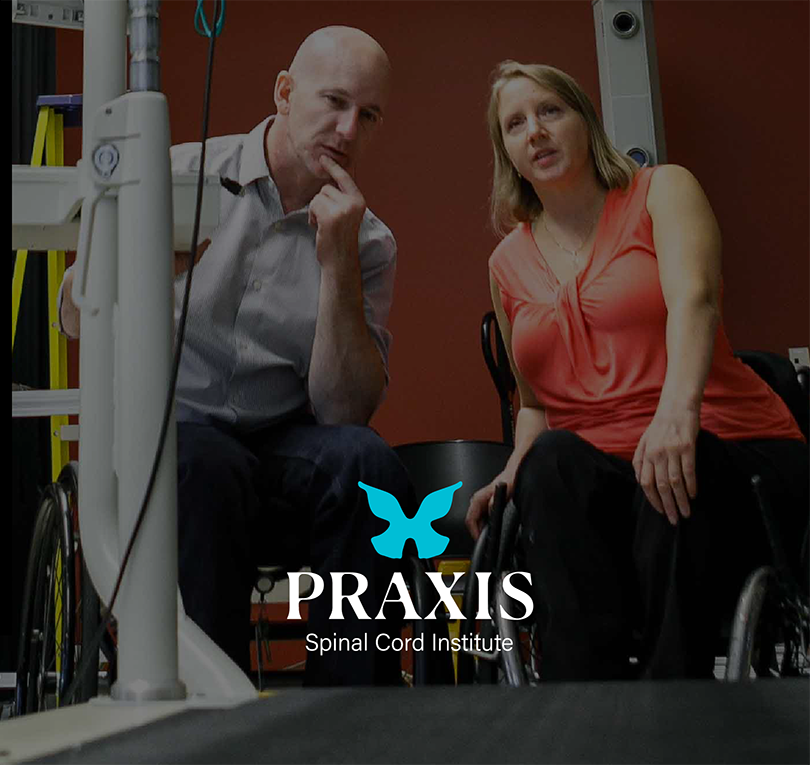 Praxis logo and two people using wheelchairs talking in front of a treadmill